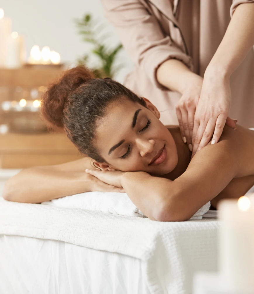Woman receiving a massage while being relaxed and calm